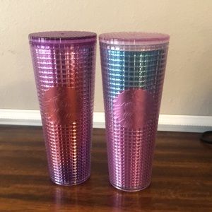 2 Starbucks 24oz tumblers with lids.